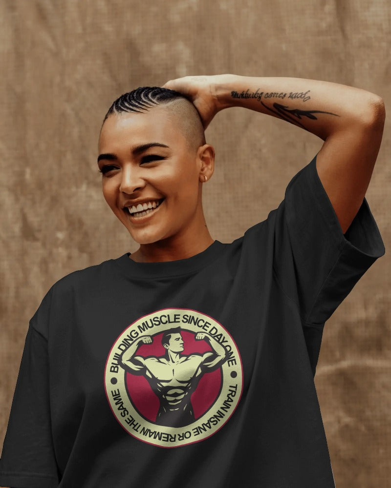 "Building Muscle Since Day One" Vintage Bodybuilding T-Shirt - Retro Fitness Badge Tee