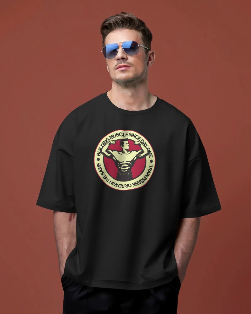 "Building Muscle Since Day One" Vintage Bodybuilding T-Shirt - Retro Fitness Badge Tee