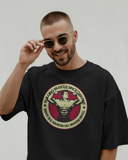 "Building Muscle Since Day One" Vintage Bodybuilding T-Shirt - Retro Fitness Badge Tee