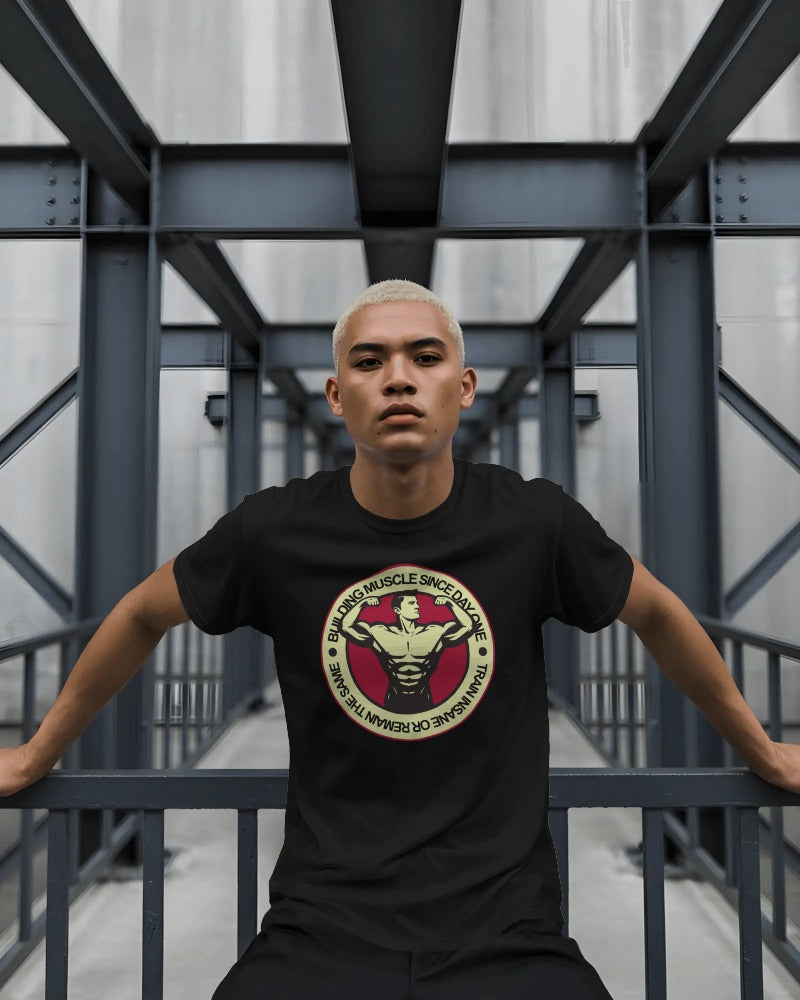 "Building Muscle Since Day One" Vintage Bodybuilding T-Shirt - Retro Fitness Badge Tee